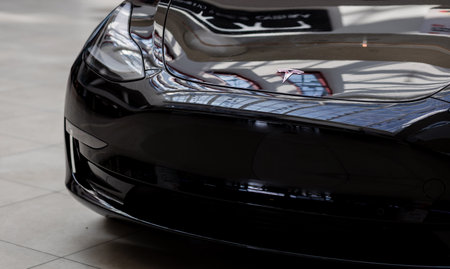 Minsk, Belarus, April 2023 - Electronic Car Tesla. Hood, headlamp, front.のeditorial素材