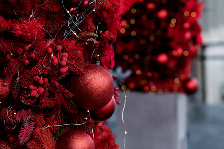 christmas and new year holidays concept. Red balls on fir branches. festive winter background.の写真素材