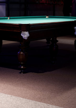 empty billiard table with wooden legsの写真素材