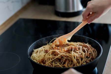chef cook making Italian pasta with at modern kitchen stove in panの写真素材
