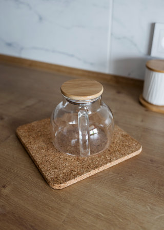 elegant transparent glass teapot on table.の写真素材