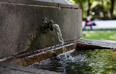Fountain Spraying Water in public parkの写真素材