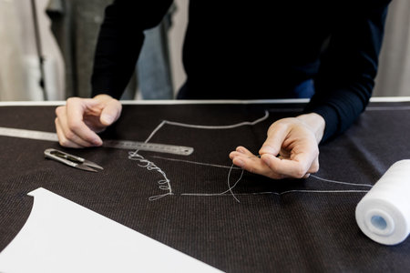 Craftsman tailor at work in the workshop or atelier. Concept of fashion, handmade, handcraft,...