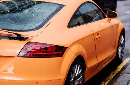 rear lights of super car. raindrops on a sports carの写真素材