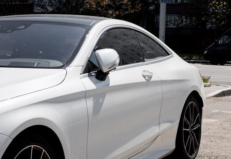 white luxury premium car parked on the road.の写真素材
