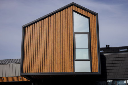 luxurious modern house exterior over blue sky backgroundの写真素材