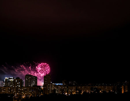 colorful fireworks in the night sky above the cityの写真素材