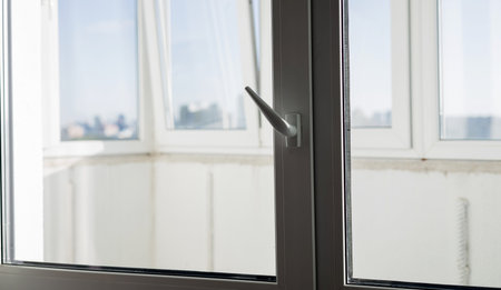 Window handle detail. pvc double glazing