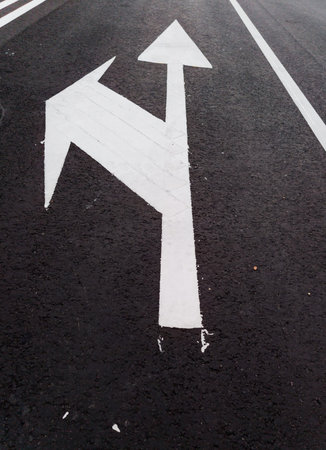 road marking. White arrows on asphalt
