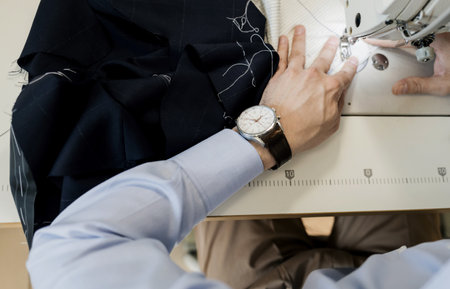 Man working with sewing machine. tailor in the workshopの写真素材