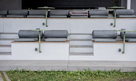 Modern outdoor seating arrangement with minimalist furniture. Cozy street terraceの写真素材