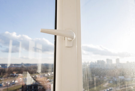 New plastic pvc windows on balcony in sunny dayの写真素材