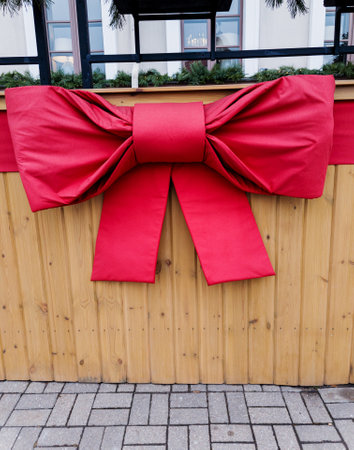 Luxury red bow on wooden wall. Holiday decorationの写真素材