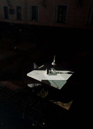 Cozy dining table in dark interior cafe