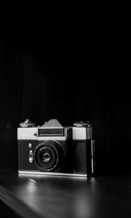 Old camera on desk. Photographer's equipmentの写真素材