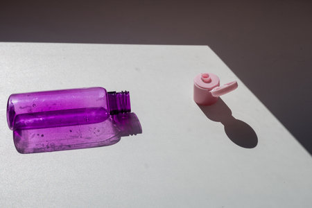 Clear blue plastic bottle for cosmetic products on white backgroundの写真素材