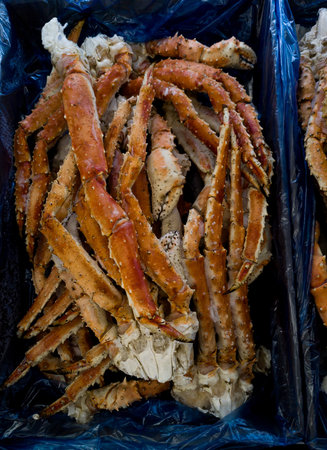 Several crab legs displayed on presenting a seafood delicacyの写真素材