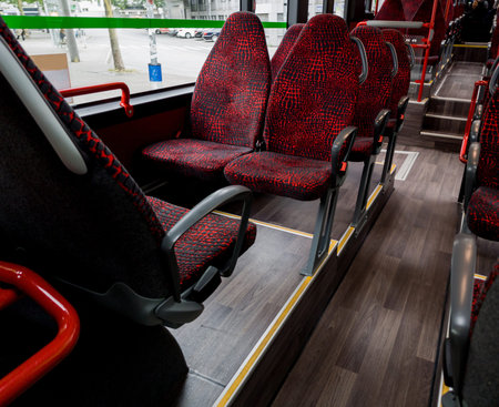 Interior of city bus with seats. Spacious and empty interior