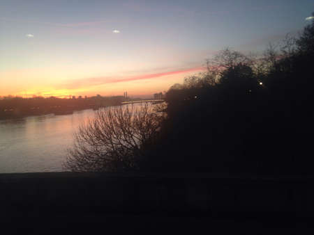 A picture of the Thames crossing Waterloo Bridge on a cold winter morningの素材