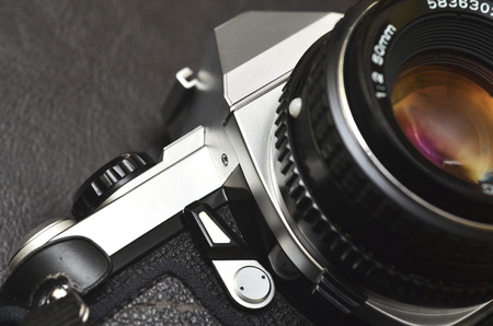 Macro close up shot of a silver classic film camera SLR with lensの写真素材