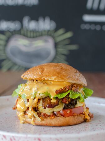 Delicious Hamburger with Chili and Chesse, blackboard backgroundの写真素材
