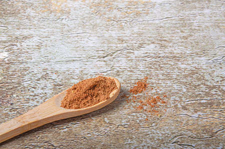 Various species in wooden spoons on rustic background (rustic)の写真素材