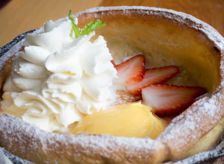 mini pancake with lemon curd and strawberry slices in Dutch styleの写真素材