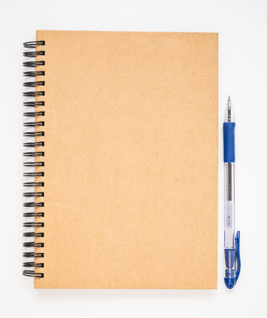 A blank brown notebook cover with blue penの写真素材