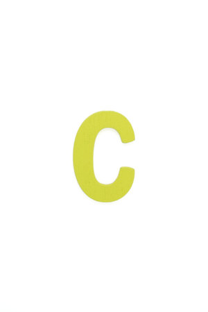 C capital letter - yellow color alphabet made from wood isolated on white backgroundの写真素材