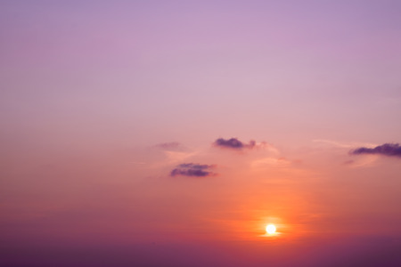 Beautiful pink purple sky sunset with little clouds at twilight timeの写真素材