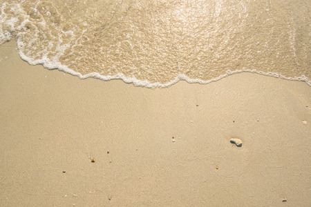 Sea wave on the sand beach for backgroundの写真素材