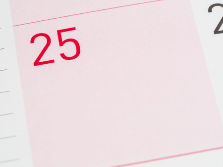 Red 25th date of the month on calendar paperの写真素材