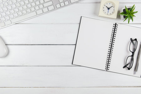 Top view of an empty blank open notebook on the minimal office desk