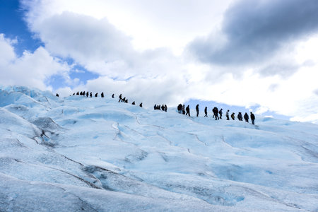 People climbing glacier, telephoto view,  holiday travel. Globalの写真素材