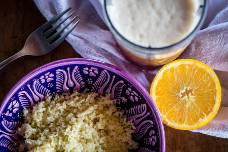 Bowl of ceral in purple turkish bowl, on a white marble tabletop.の写真素材