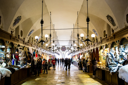 Krakow, Poland - Circa January, 2014: The crowded Cloth Hall gallery, or Sukiennice, located on Rynek Glowny, the main market square in the old town of Krakow.のeditorial素材