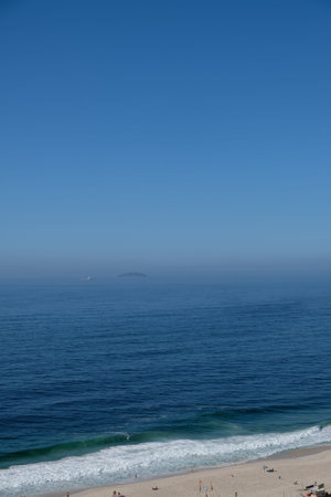 view of Copacabana beach during early morning, taken from the rooftop of a hotel, some slight fog...