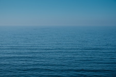 Cloudy horizon and Fog over the sea waves, natural backgroundの写真素材