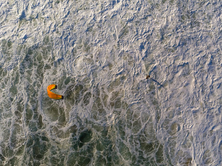 Drone photo of beach in Barra da Tijuca, Rio de Janeiro, Brazil. Waves crashing with whitewash,...