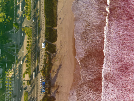 Drone photo of beach in Barra da Tijuca, Rio de Janeiro, Brazil. Waves crashing with whitewash, the...
