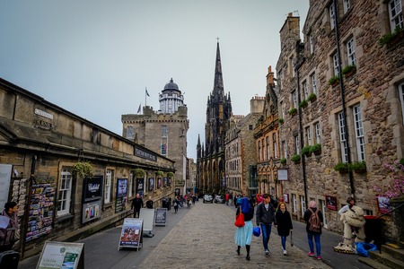 EDINBURGH, SCOTLAND - April 2017: Looking down the Royal Mile in the Old Town in Edinburgh Scotland. The Royal Mile is the most popular attraction in Edinburgh and hosts many tourists.のeditorial素材