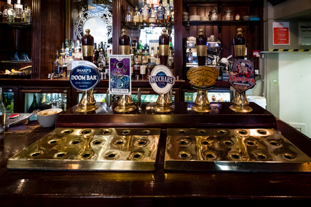 Edinburgh, Scotland - April 27, 2017 : Beer taps inside traditional english pub in Edinburgh, Scotlandのeditorial素材