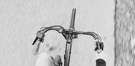 top view of man riding electric bike, motion blur.