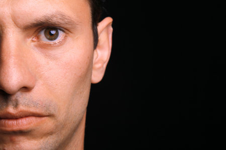 young man over black backgroundの写真素材