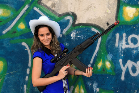 cowboy fashion girl in graffiti background
