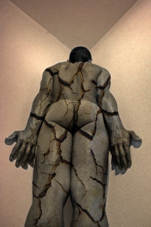 naked and alone man in old buildingの写真素材