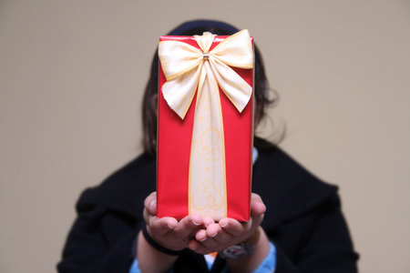 young girl giving gifts (focus on the present)