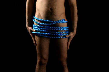 a muscular man posing artisticの写真素材