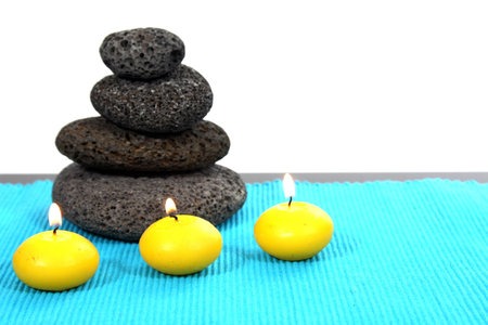 candles and massage stones in a calm zen spasの写真素材