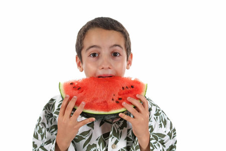 boy and watermelon isolated on whiteの写真素材
